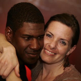 Intimate Embrace Between Two People at Evening Event