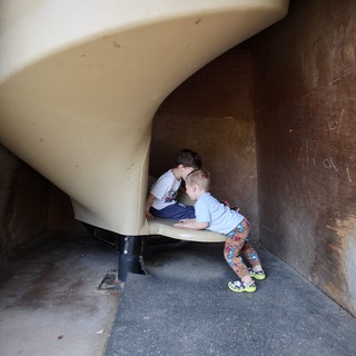 Children Exploring Tunnel Slide at Fantasyland Playground