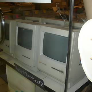 Macintosh Computer as Furniture in a Bathroom