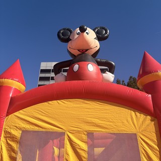 Cheerful Monkey Inflatable Bounce House at Outdoor Event