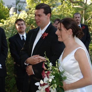 Travis and Penelope Exchange Vows at Outdoor Wedding