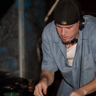 Blue-Shirted Travis B Spins Beats on the DJ Set
