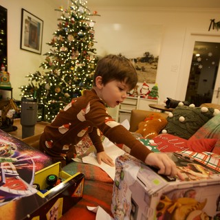 Christmas Morning Joy: Child Opening Presents