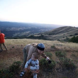 Mother and Toddler Explore Hilltop at Golden Hour