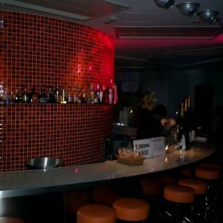 Red-Lit Bar with Stylish Interiors