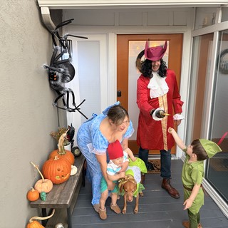 Family Halloween Trick-or-Treating at the Front Door