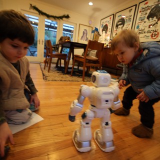 Children Discover Interactive White Robot at Home