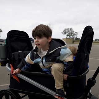 Young Boy in Adaptive Wheelchair at Outdoor Location