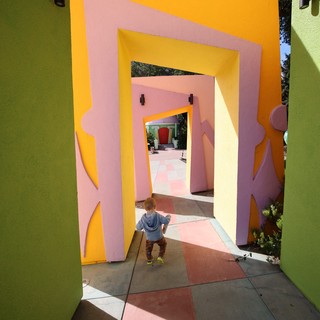 Child Exploring Colorful Geometric Portal Tunnel