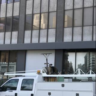 White Pickup Truck Parked in Front of LA Office Building
