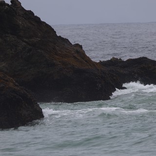 Dark Coastal Rocks Battered by Atlantic Swells