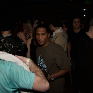 Blue Shirt in a Nightclub Crowd