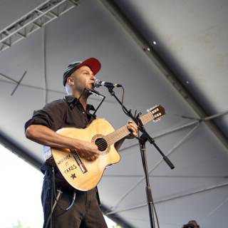 Tom Morello Rocks the Stage with His Guitar and Mic
