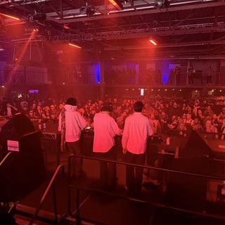 Electronic Music Concert Performance with Dramatic Red Stage Lighting