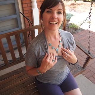 Woman Showing Off Turquoise Jewelry on Porch Swing