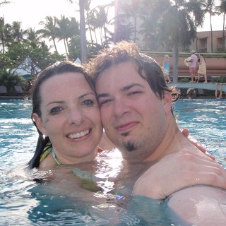 Couple's Romantic Pool Moment in Hawaii Resort