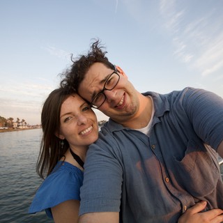 Couple's Joyful Selfie on a Summer Waterway