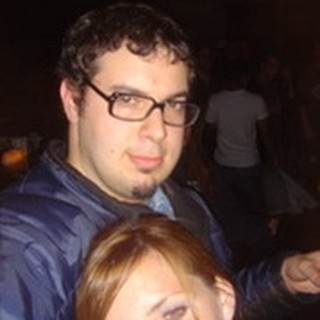 Couple Posing Together at a Nighttime Event