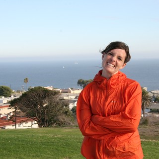 Smiling Woman Overlooking Coastal California Town