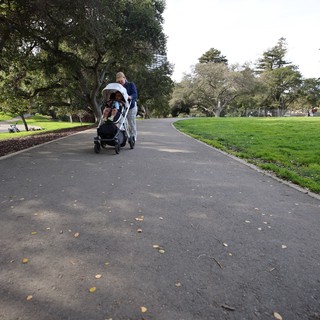 Family Stroll Through the Park on an Overcast Day