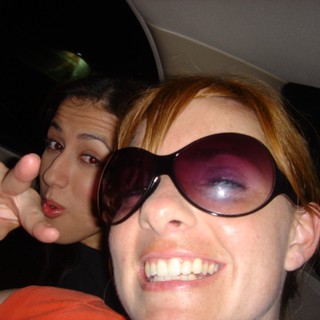 Two Friends Goofing Off in a Car at Night