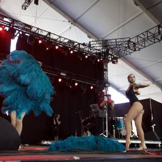 Blue Feathered Duo Rocks the Stage at Coachella Music Festival