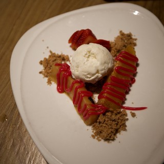 Artfully Plated Dessert with Ice Cream and Strawberry Coulis
