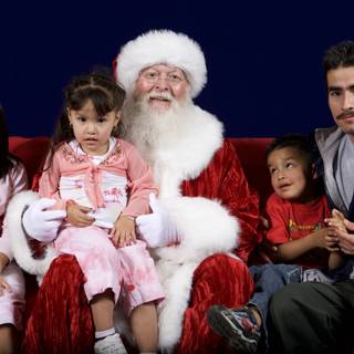 Santa Claus spreading holiday cheer with children