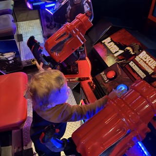 Young Gamer Playing Retro Arcade Game