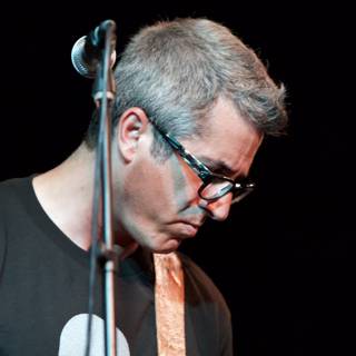 Brett Gurewitz Rocks the Stage with his Guitar and Glasses