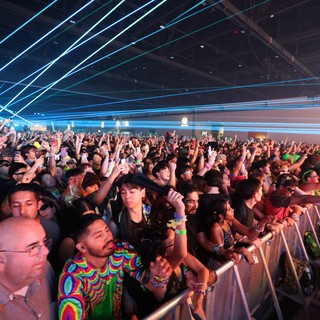 Massive Crowd Illuminated by Laser Light Show