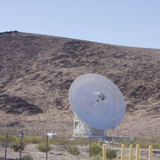 Radio Telescope Among the Rough Desert Landscape