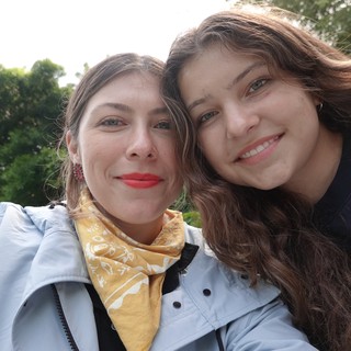 Two Friends Taking Sunny Outdoor Selfie