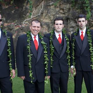 The Four Suited Gentlemen Caption: Dustin, Aaron, and Mark make a dapper group on the Hawaiian grasslands in their formal wear, complete with flower arrangements and matching red ties.