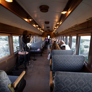 Vintage Railway Car Entertainment Experience with Cowboy Performer
