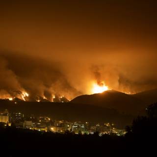 Flames Ravaging the Hills Above the City