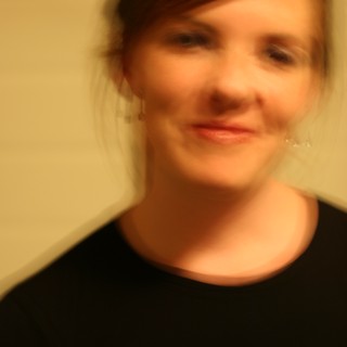 Soft Focus Portrait of Smiling Woman in Black
