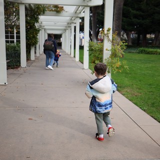 Child Walking Under White Pergola at Skywalker Ranch