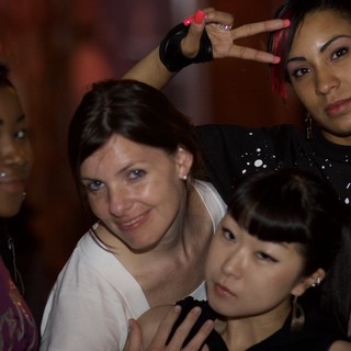Four Women Posing Together at Nightclub Event