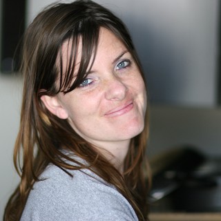 Candid Portrait of a Woman with a Warm Smile