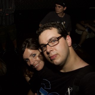 Friends Posing Together at a Nightclub Party