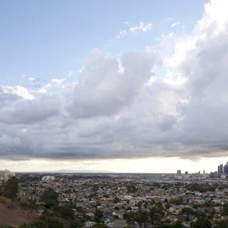 Majestic cumulus clouds over a bustling metropolis