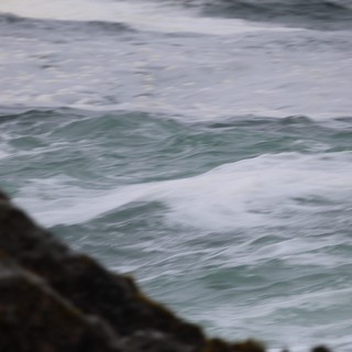 Churning Atlantic Waves Crash Against Rocky Coastline