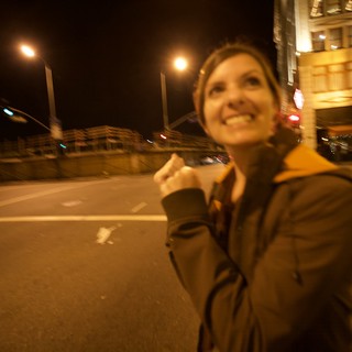 Joyful Woman Celebrating on City Streets at Night