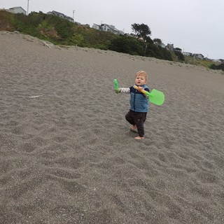 Toddler's Big Adventure on a Gray Beach