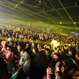 Massive Indoor Crowd Erupts Under Green Laser Lights