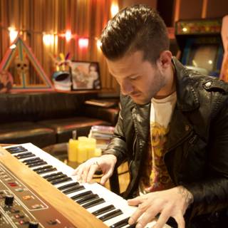 Man in a Leather Jacket Playing Electronic Keyboard