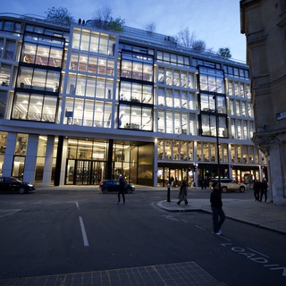 Modern Glass Office Building Illuminated at Dusk in London