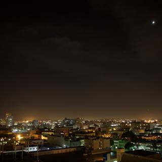 Lunar Eclipse Illuminating the Metropolis