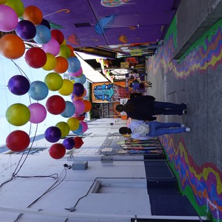 Vibrant Balloon-Decorated Street Art Alley